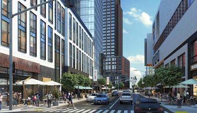 A bustling urban streetscape, with pedestrians crossing, trees lining both sides of the street, and buildings flanking the bustling thoroughfare.