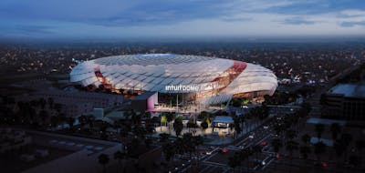 At night, the roof of the Intuit Dome is brightly lit.