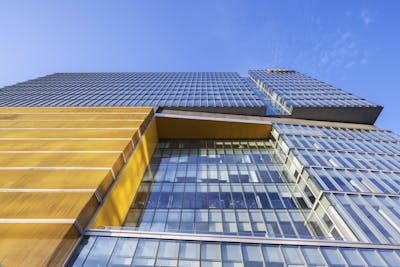 Looking straight up at the VCU Adult Ambulatory Care Facility facade from the ground level.